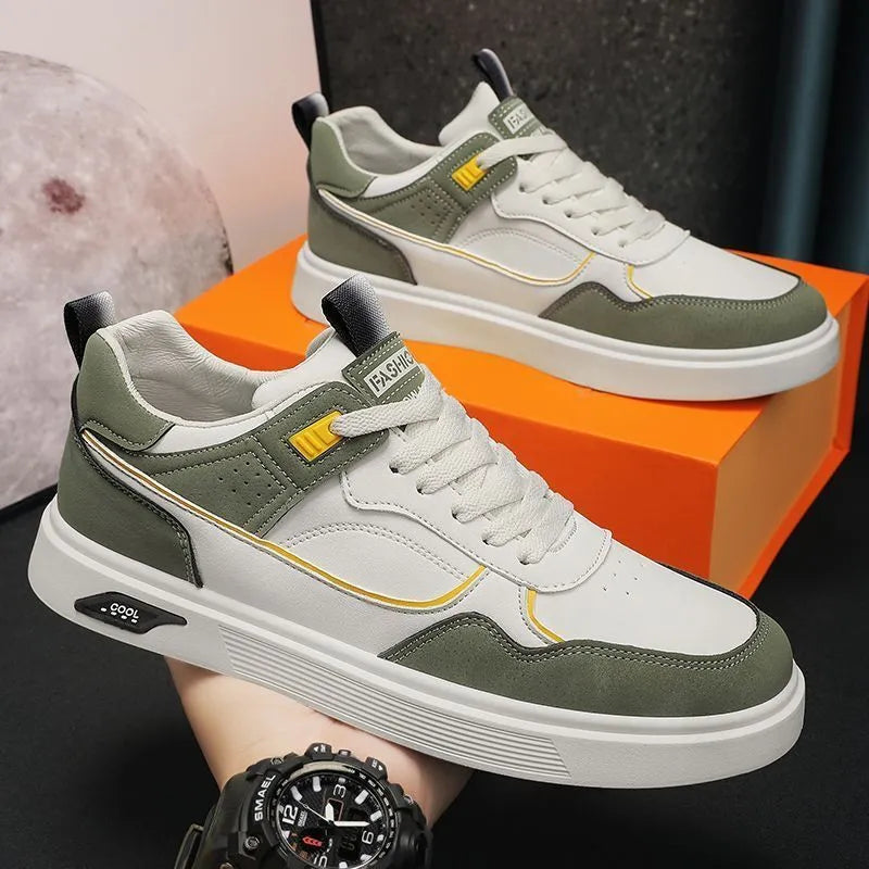 Men's beige low-top canvas board shoes with leather stitching details on a white background.