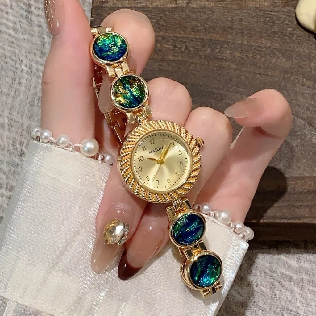 Women's quartz watch with round 25mm dial in one of six colour options on a wrist