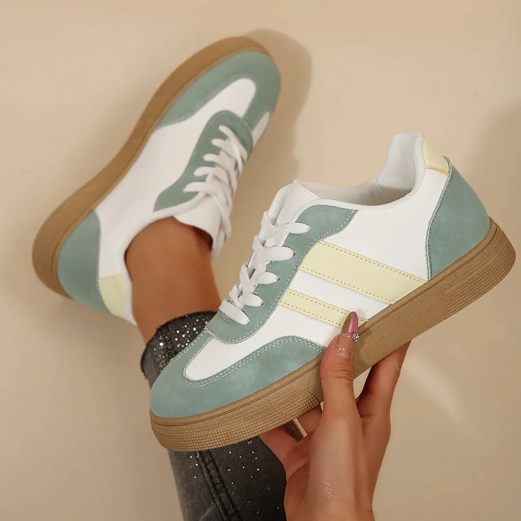 Women's green retro casual trainers with cross straps and round toe design on rubber sole