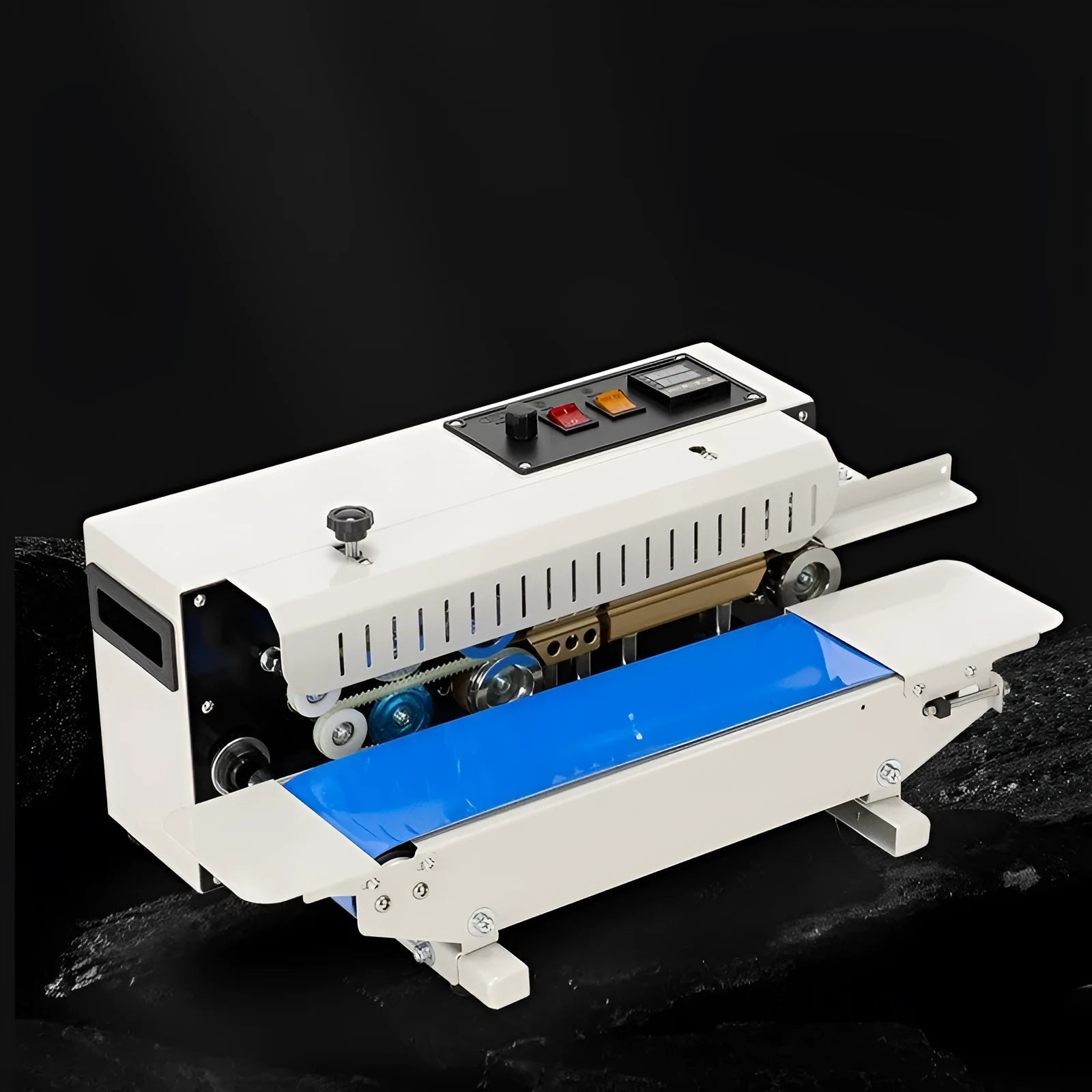 Compact manual steel seal sealing machine with integrated date printer on a worktop.