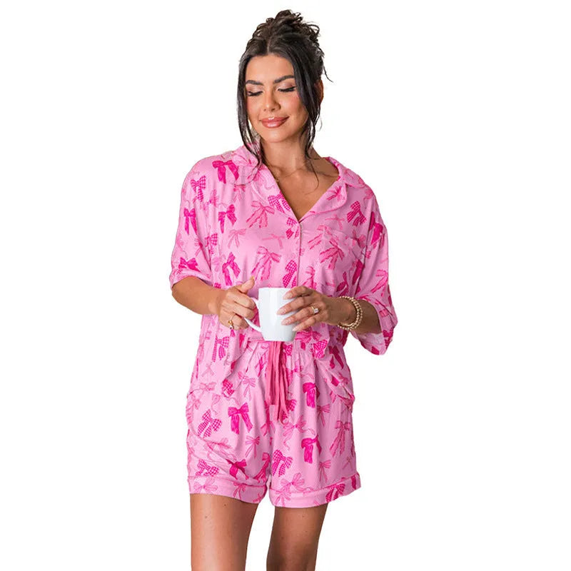 Pink bow print polyester pyjama two-piece set with separate top and trousers