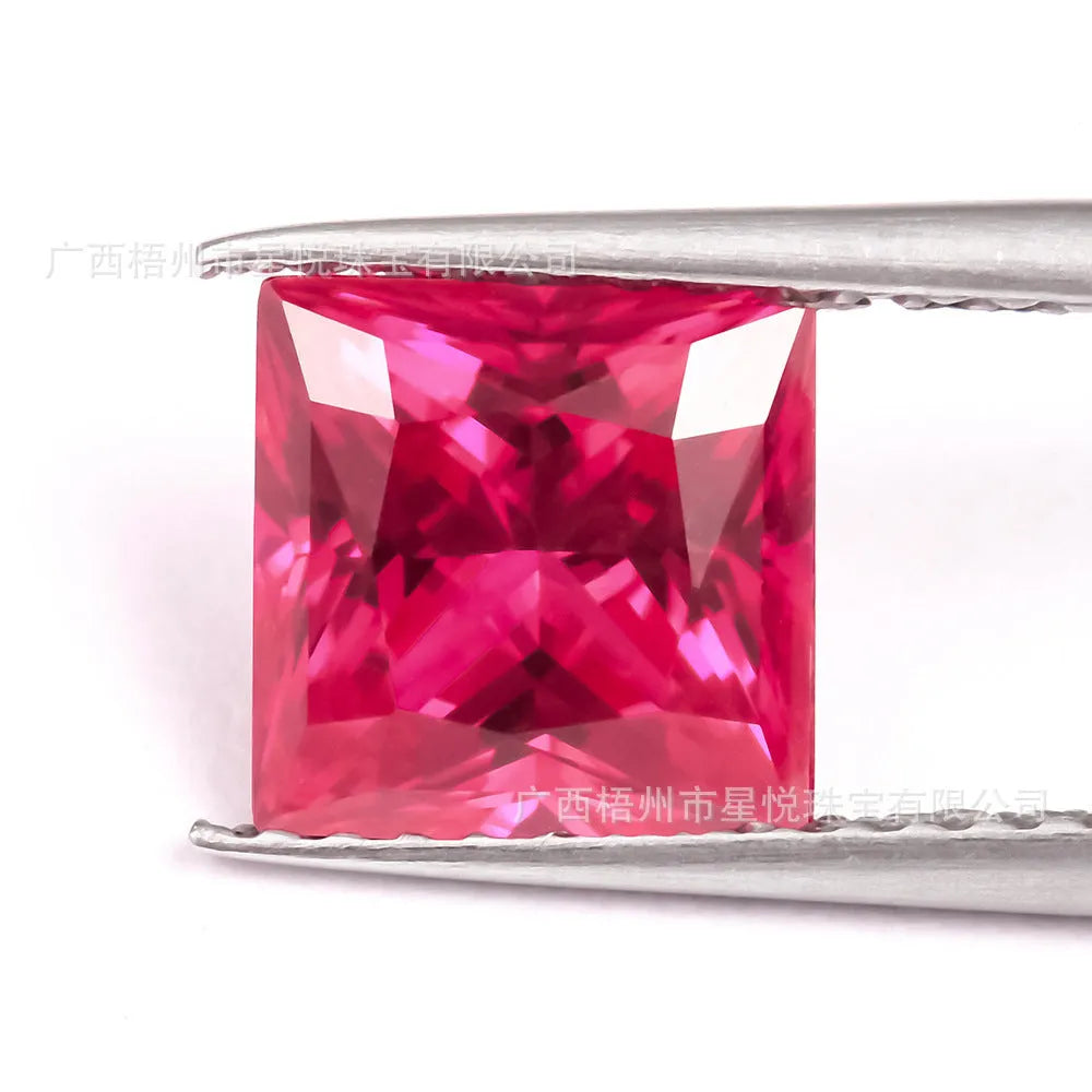 A loose, faceted artificial ruby gemstone in a deep pigeon blood red colour.