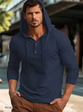 A dark blue cotton pullover hoodie with long sleeves on a hanger.