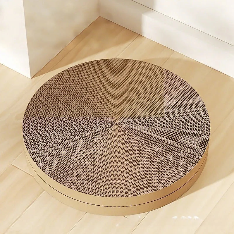 Round green cat scratching board with replaceable corrugated centre measuring 55 cm diameter