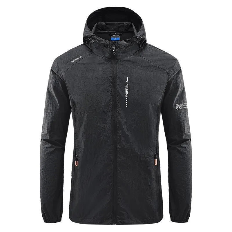 Man wearing a loose-fit light grey hooded nylon jacket for summer sun protection.
