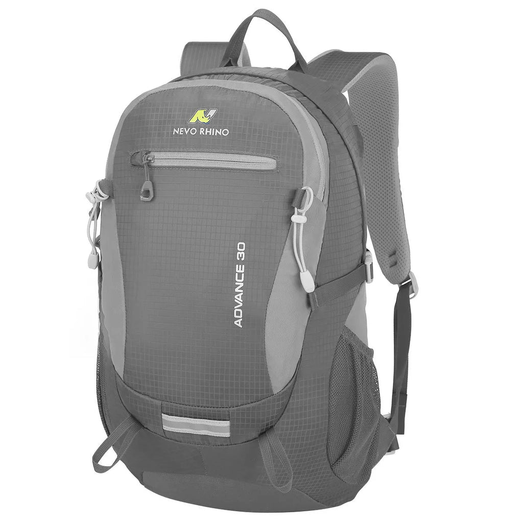 Nylon 30-litre waterproof backpack in dark green with airpillow straps, shown in an outdoor setting.