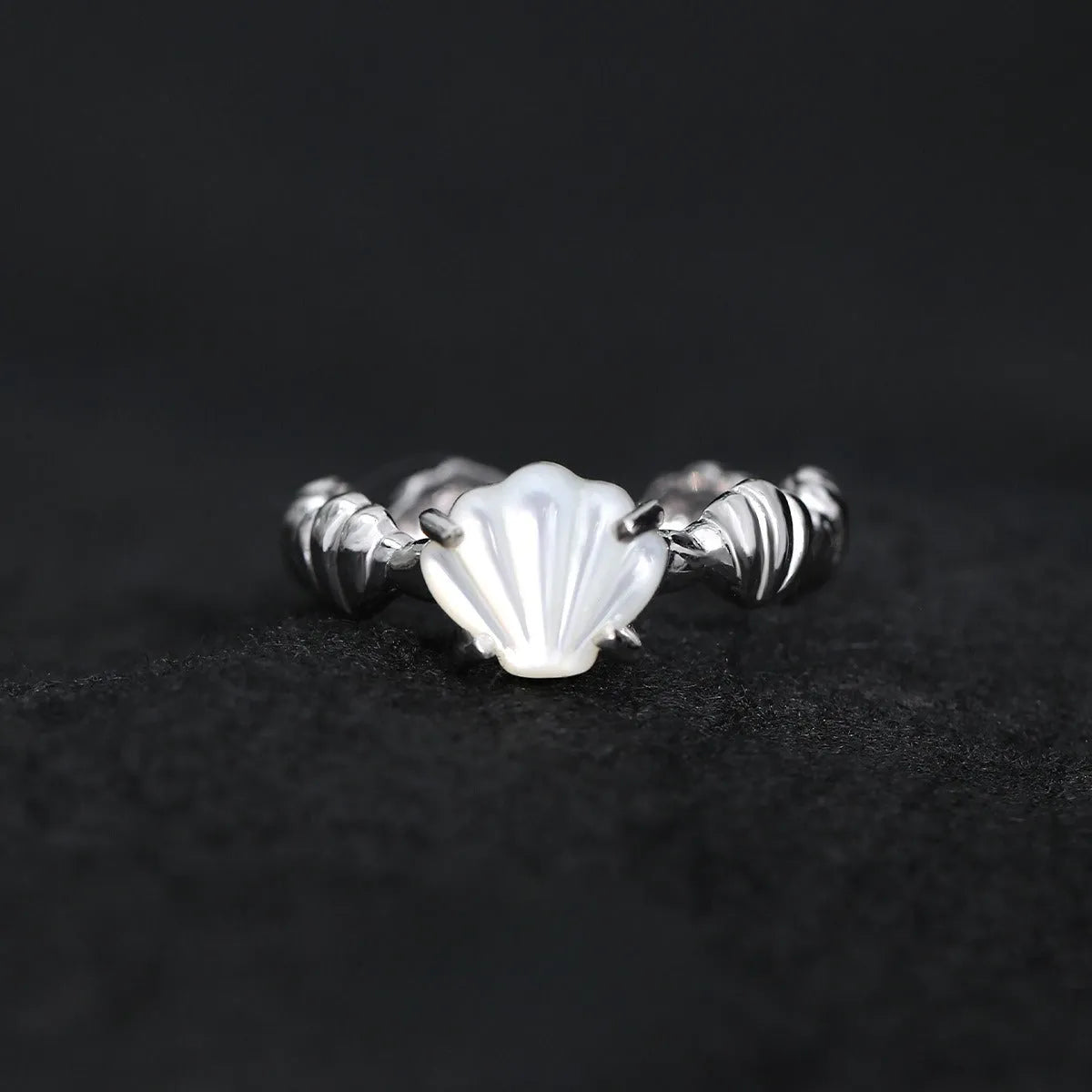 Adjustable silver women's ring with tiger eye and shell inlay in gold or white gold finish.