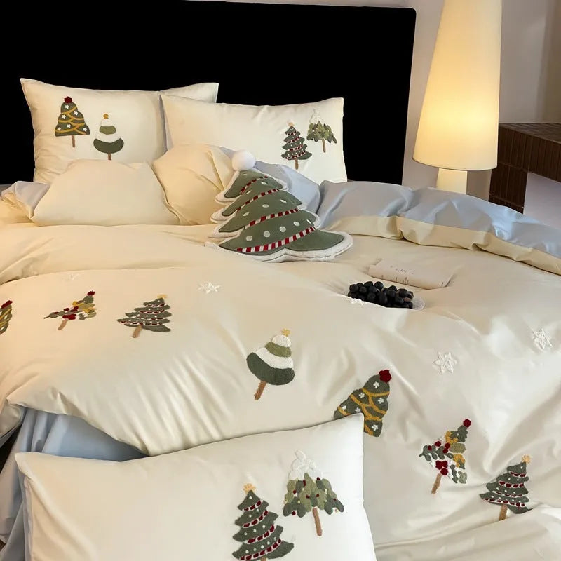 Cream blue duvet cover with embroidered Christmas tree and towel motif, part of a 100% cotton four-piece bedding set.