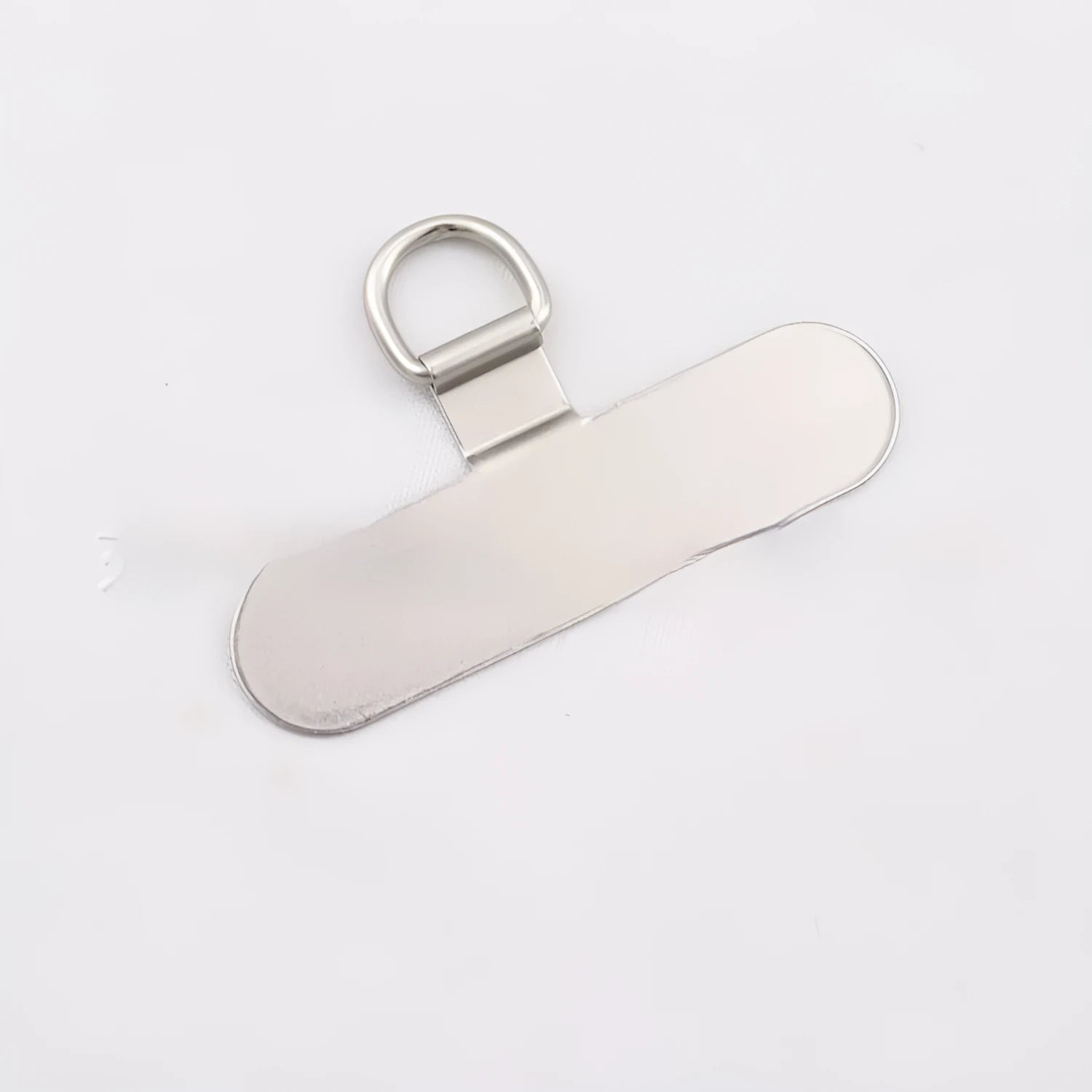 Stainless steel phone clip charging port fixing pad in 304 steel, black colour, on a phone mount