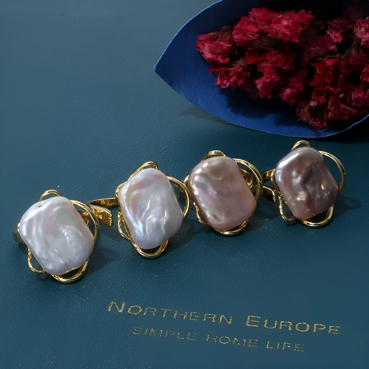 Women's adjustable baroque pearl ring with geometric shape, shown in purple and gold colour options