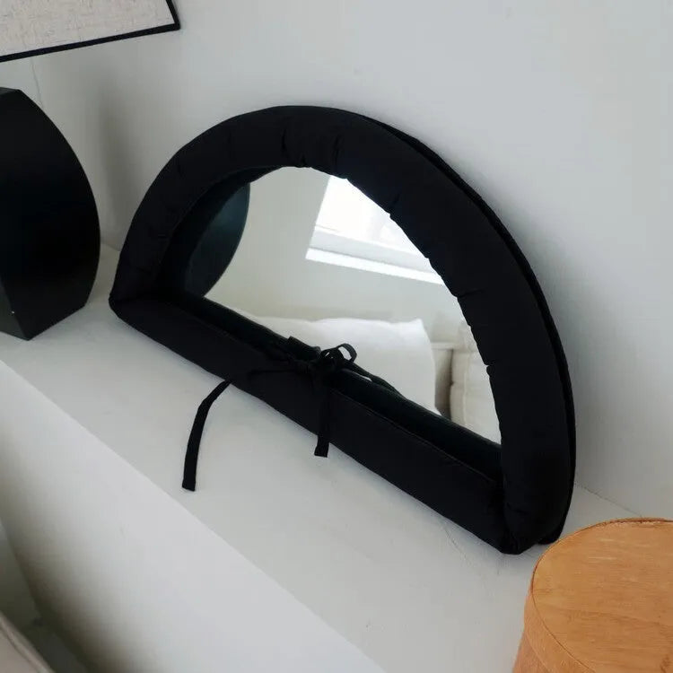 Hanging wall mirror with soft cotton-filled fabric border in black, sapphire blue, or white