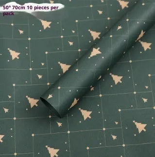 Christmas Kraft paper gift wrap sheets with red and green ink printed cartoon designs including polka dots, snowflakes, and Christmas trees