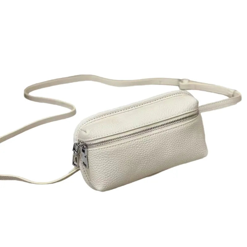 Women's mini crossbody bag in solid colour top grain leather with patchwork detail, horizontal square shape, retractable handle