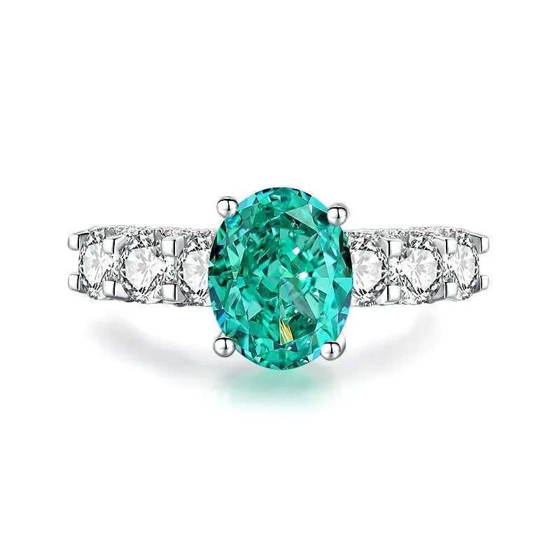 S925 sterling silver women's ring with ellipse emerald and inlaid high carbon diamond in geometric setting.
