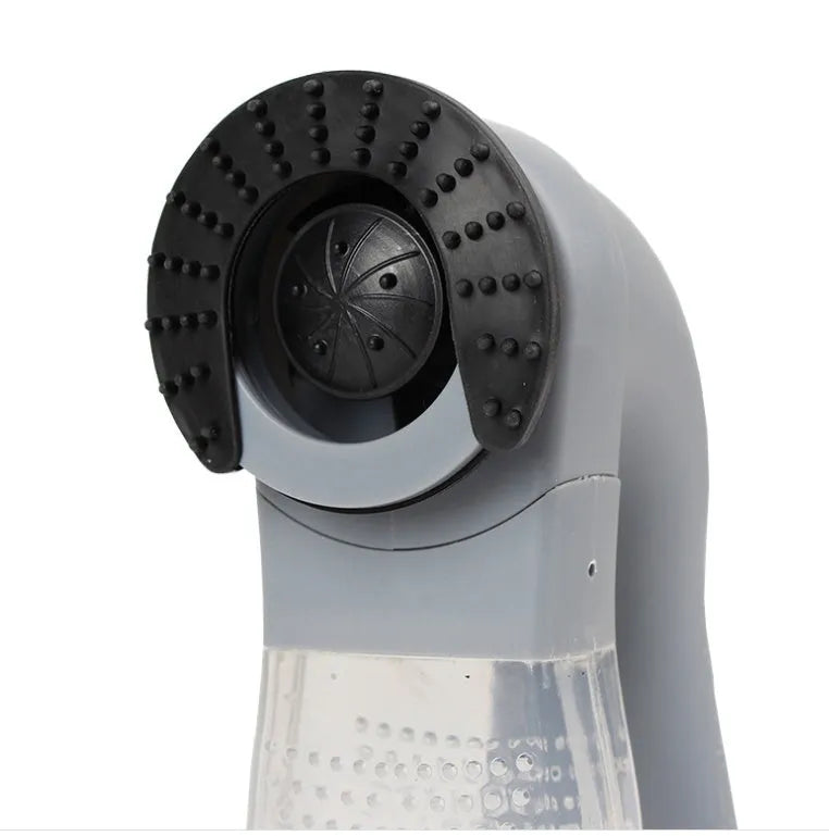 Grey portable pet hair vacuum cleaner with soft rubber head for grooming dogs and cats.