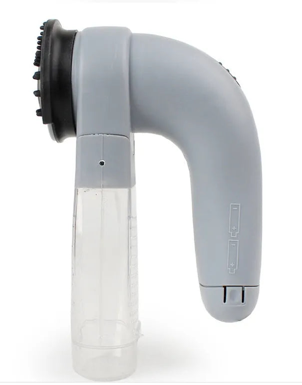 Grey portable pet hair vacuum cleaner with soft rubber head for grooming dogs and cats.