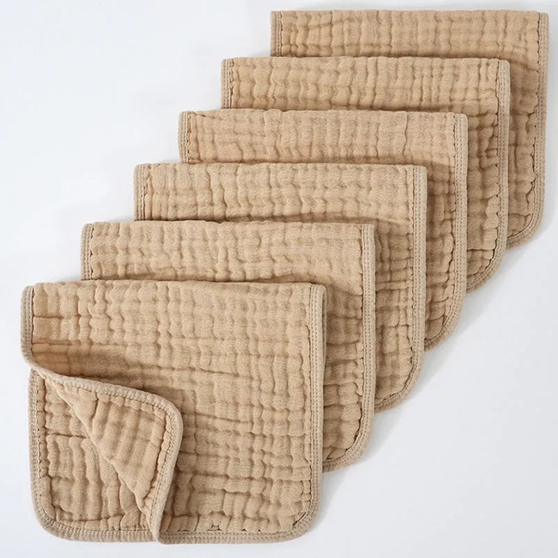 Set of six large muslin burp cloths 25x50cm in assorted colours on white background