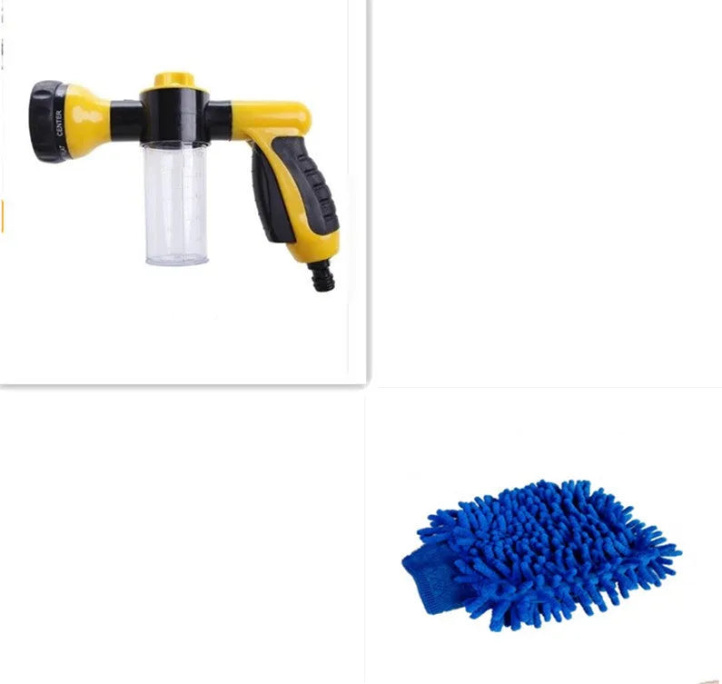 Green high-pressure foam spray gun with adjustable nozzle and attached water hose for car and garden cleaning.