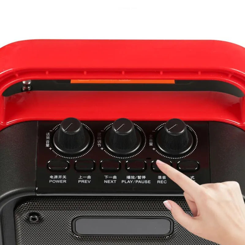 MS62AI portable Bluetooth speaker with wireless microphone on a table.