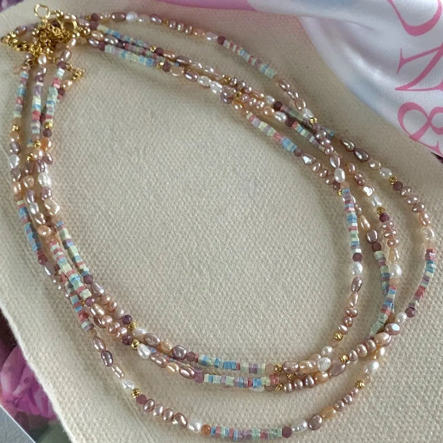 Natural pearl bracelet and necklace set with small irregular pearls and 14K gilded purple silver finish.