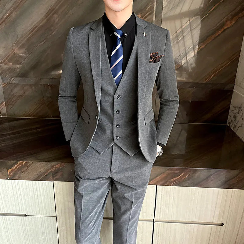 Slim fit men's business suit in British style cut, available in black or dark grey cotton blend fabric