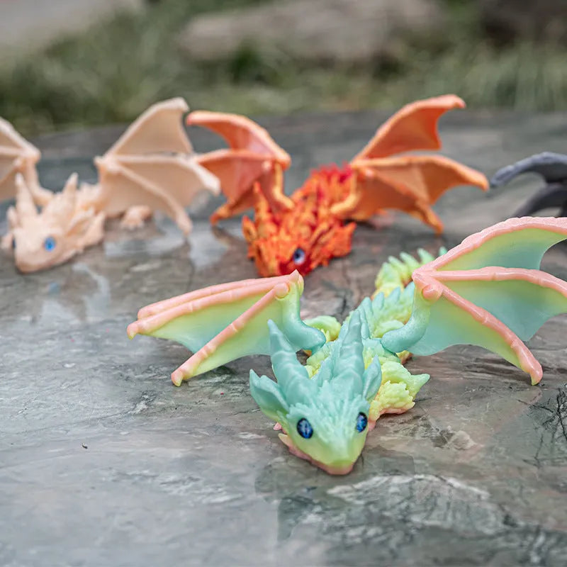 Red and gold PLA flying dragon wings decoration toy measuring 25cm wide.