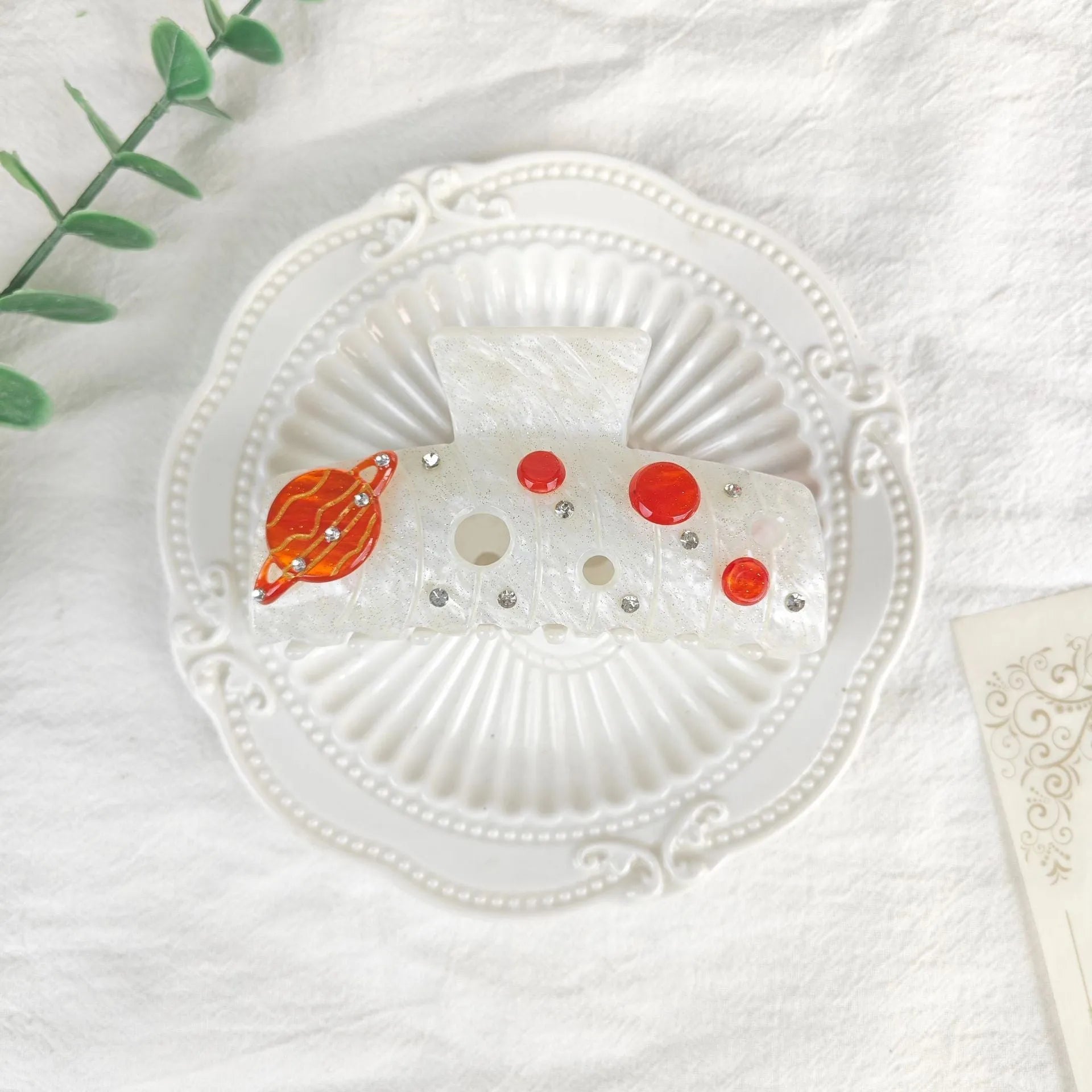 Oversized star moon barrettes with starry sky patterns in multiple colour options
