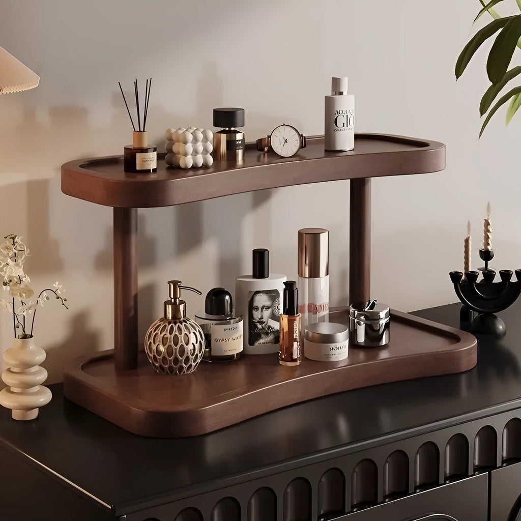 Two-layer bamboo cup storage rack on a tabletop with small items organised on both tiers