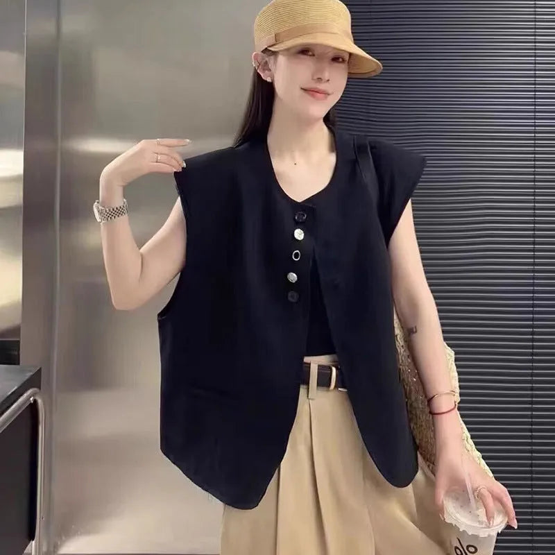 Women's loose fit sleeveless vest in beige and black, showing V-neck and pocket detail.