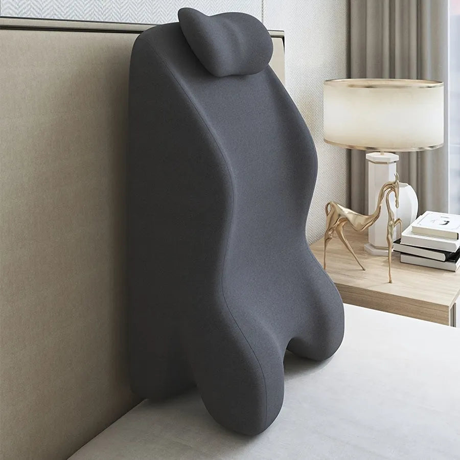 Stomach sleeper pillow in blue designed for front-lying positions, reading support, and phone use