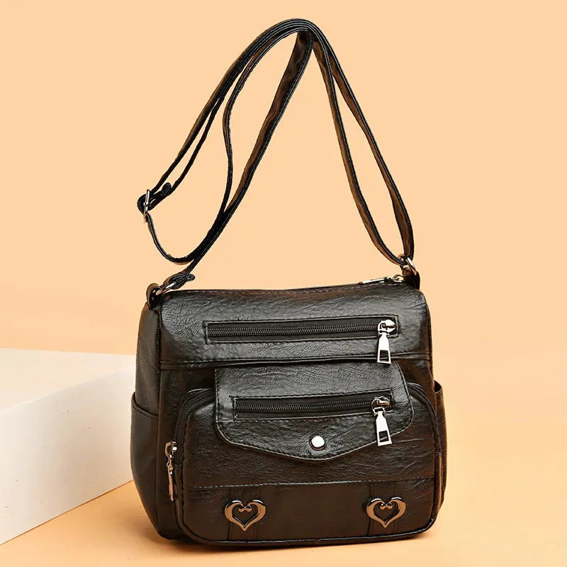 Soft PU crossbody shoulder bag with multi-pocket design in urban simplicity style, available in brown colour