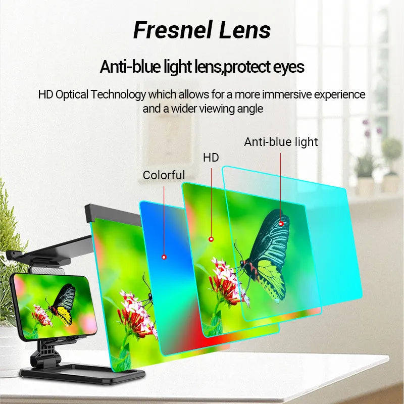 Black foldable mobile phone screen magnifier with detachable phone holder shown on a desktop.