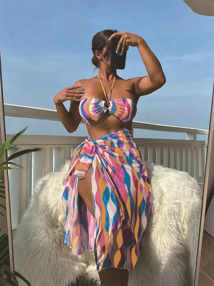 Women's three-piece split swimsuit set with top, briefs, and printed beach skirt in yellow green, magenta, or purple
