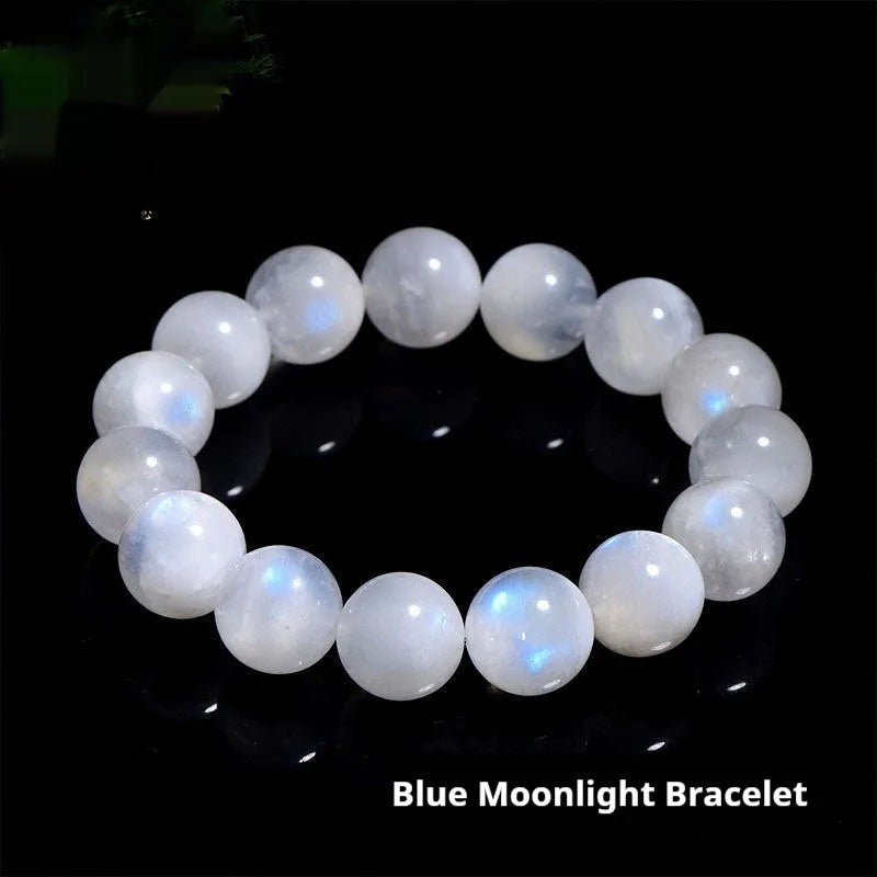Natural blue moonlight round moonstone bead bracelet on a wrist, showing adjustable closure.
