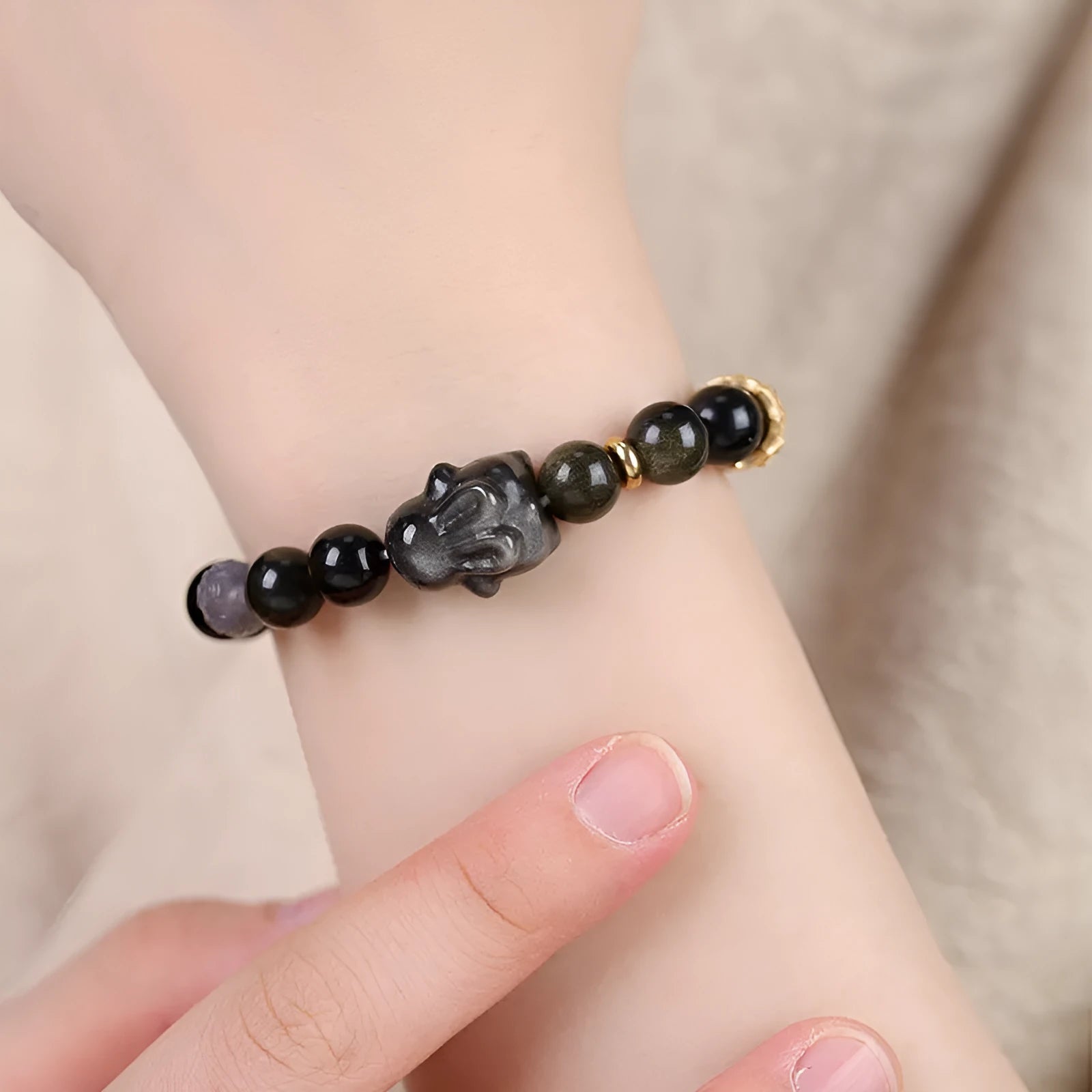 Handmade Chinese national style obsidian bracelet with lying rabbit charm and mixed metal and agate beads.