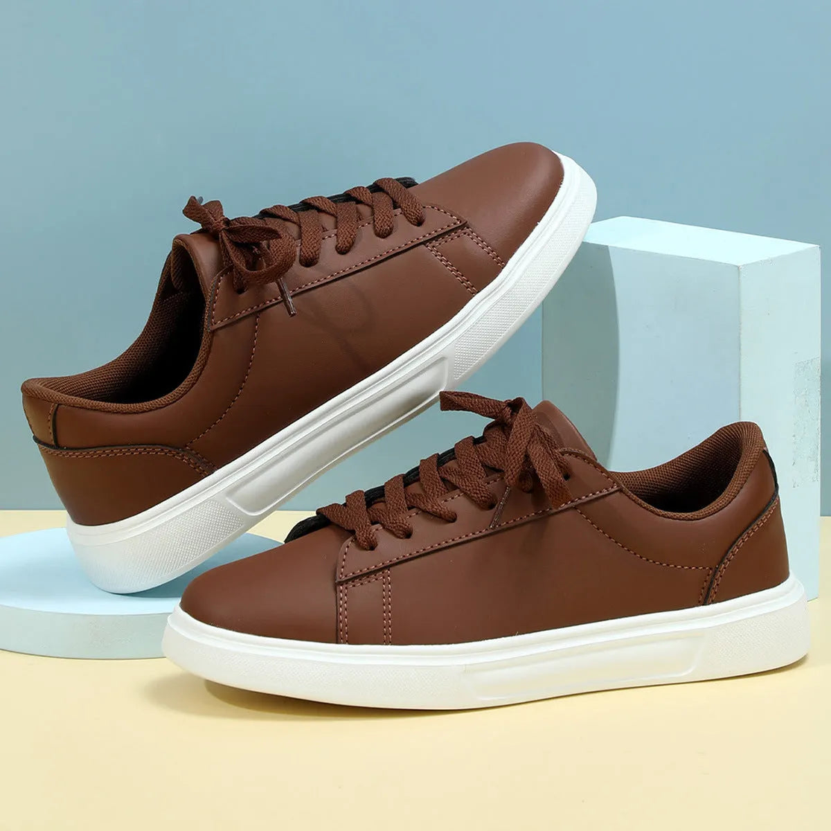 Casual beige brown platform skateboard sneaker with cross strap detail and round toe