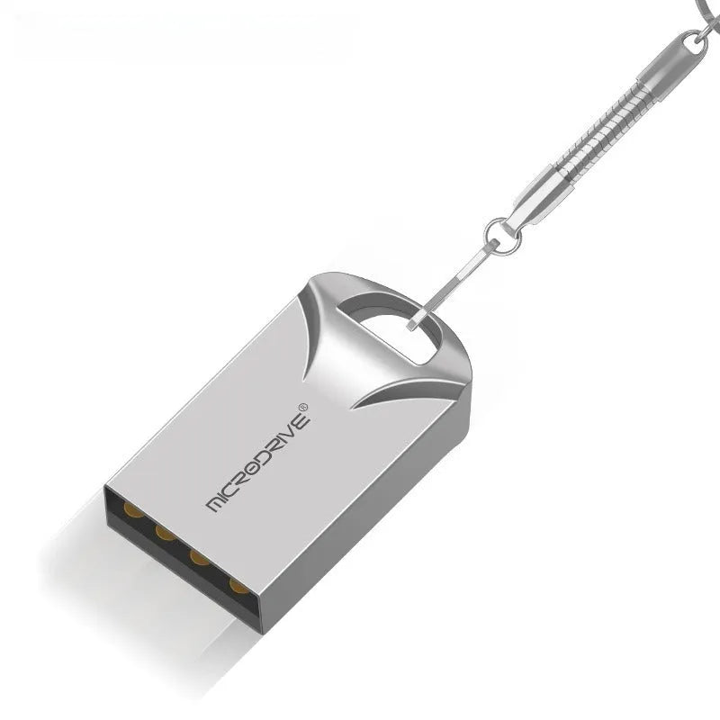 Small black and silver metal USB flash drive showing compact size next to a ruler for scale.