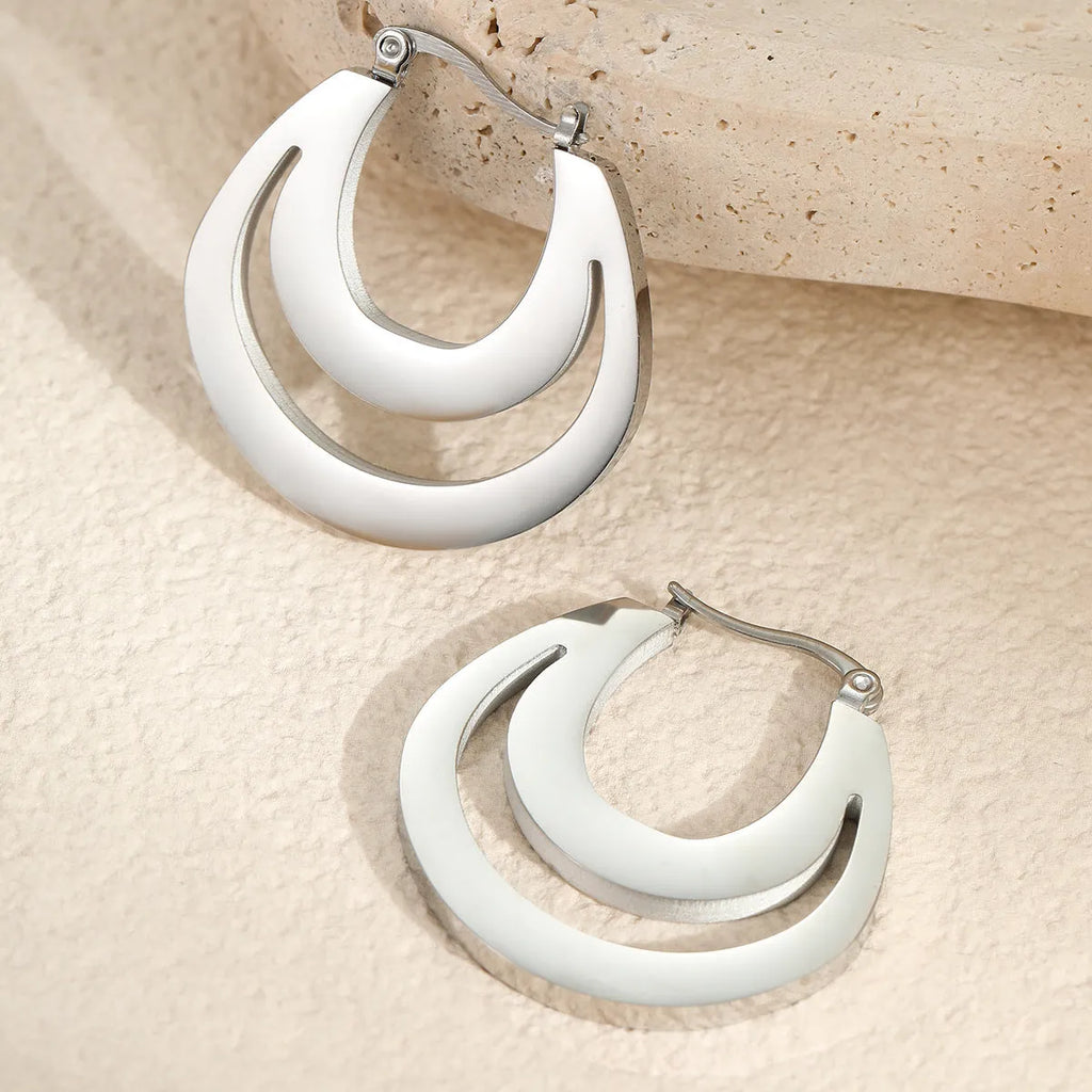Geometric gold-plated French earrings with round ring elements, available in gold or steel colour