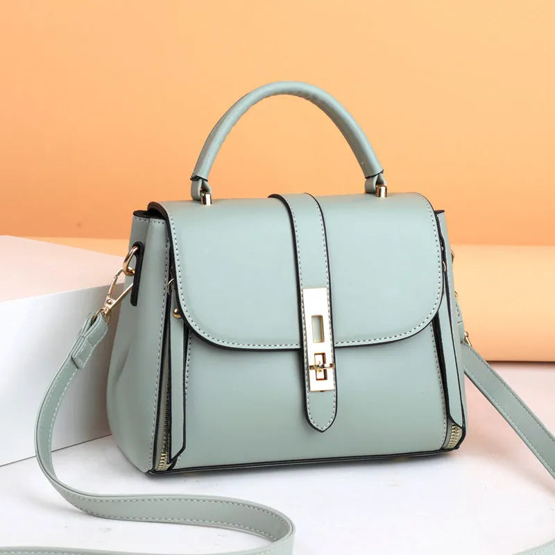 Black soft PU leather women's messenger bag with a single shoulder strap.