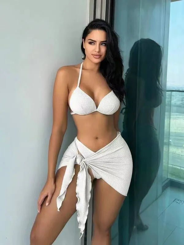Women's sexy Russian three-piece swimsuit set in a solid colour, showing top, skirt, and panties.