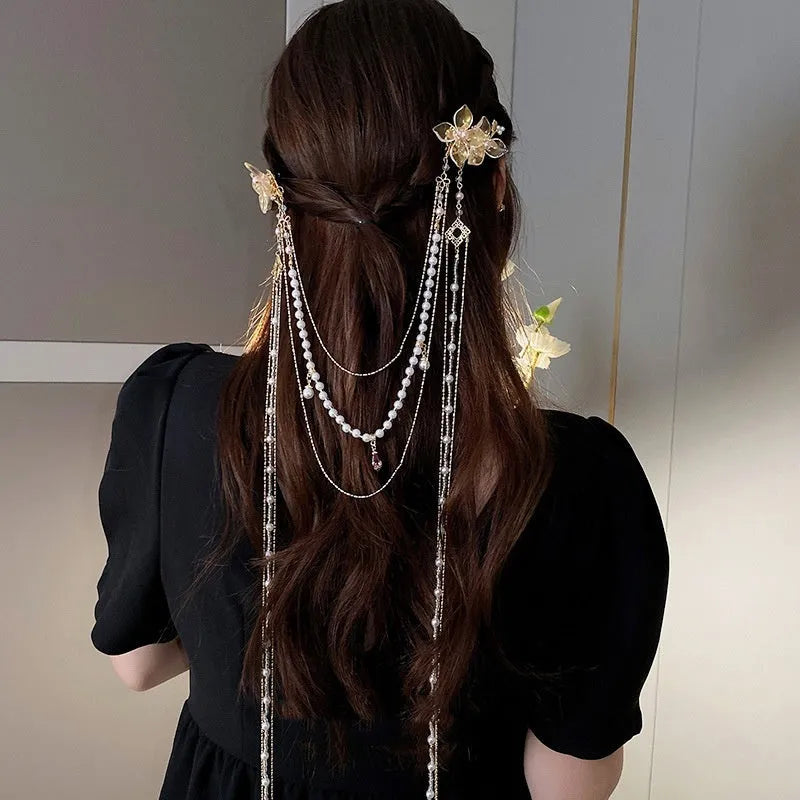 Gold tone acrylic hairpin with pearl diamond flowers and long tassel design