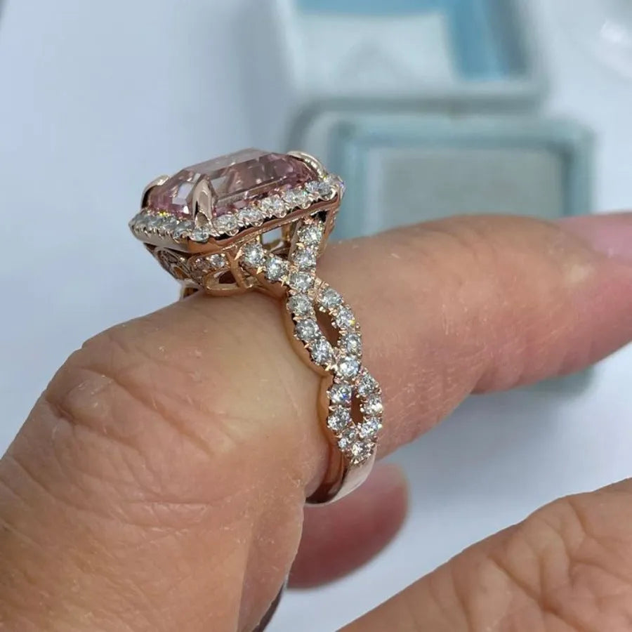 Women's rose gold electroplated alloy geometric ring shown in seven available sizes
