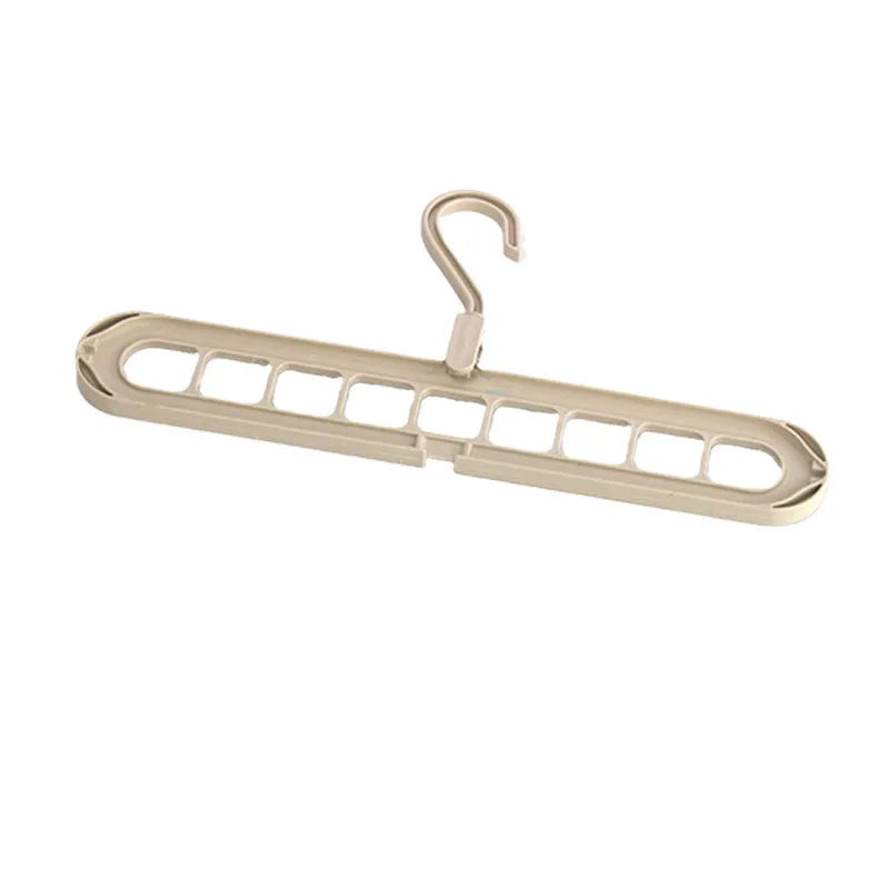 Multifunctional plastic hanger with nine holes for folding trousers, shown in beige