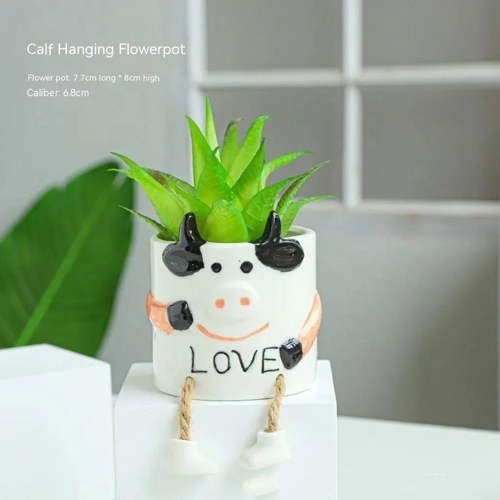 Ceramic hanging foot flowerpot in a cartoon style, shown as a desktop planter for succulent plants.