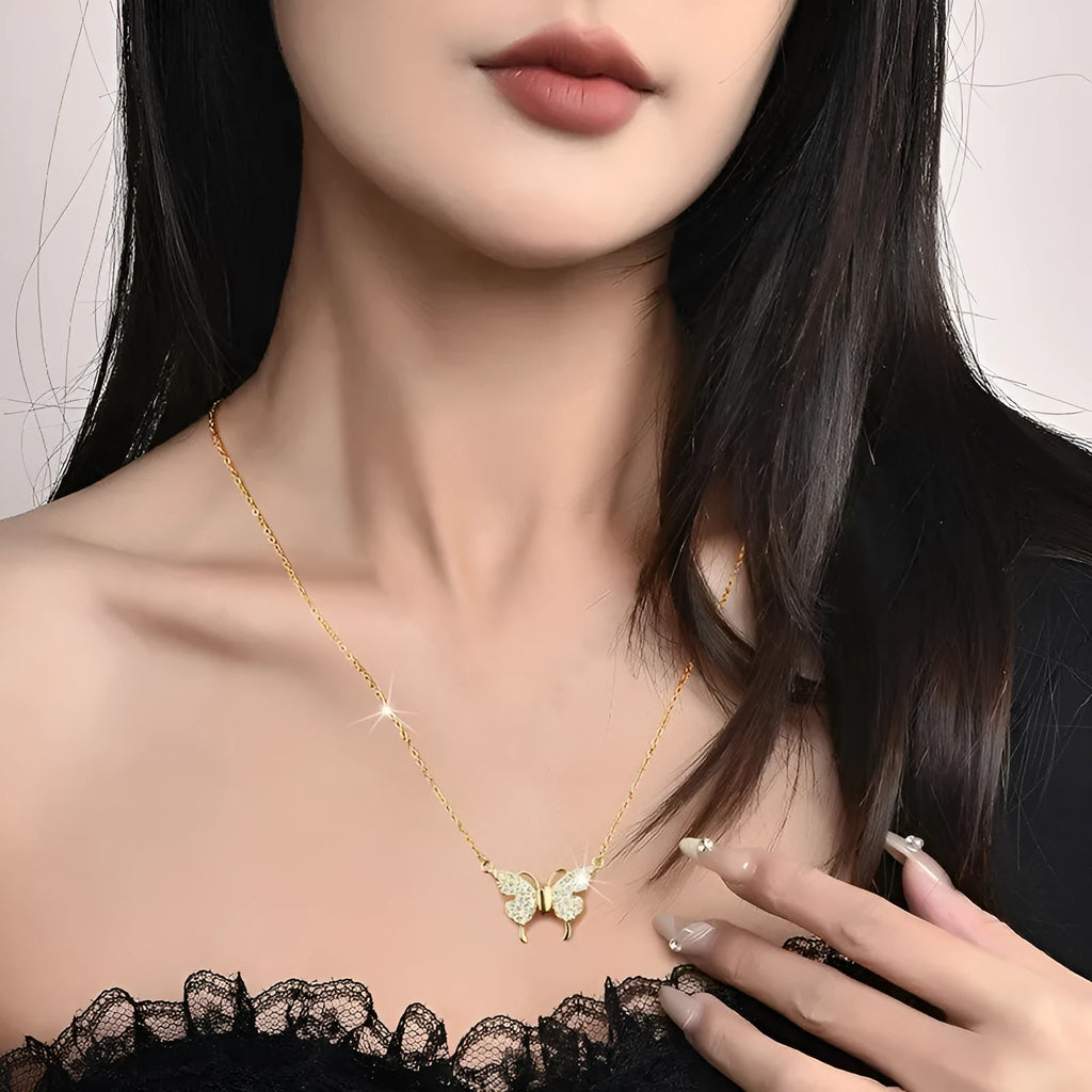 Women's clavicle necklace with butterfly pendant on twisted chain, showing magnetic snap closure