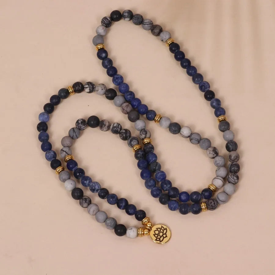Multi-layer blue bracelet with patterned network stone beads on an alloy chain, natural style.