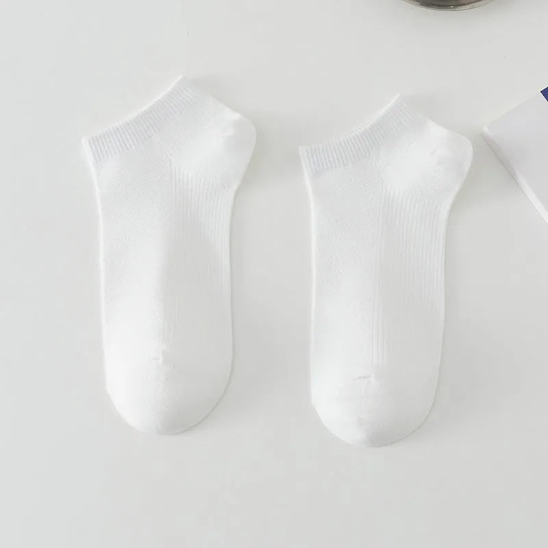 Men's solid colour polyester low-cut boat socks shown in multiple colour options