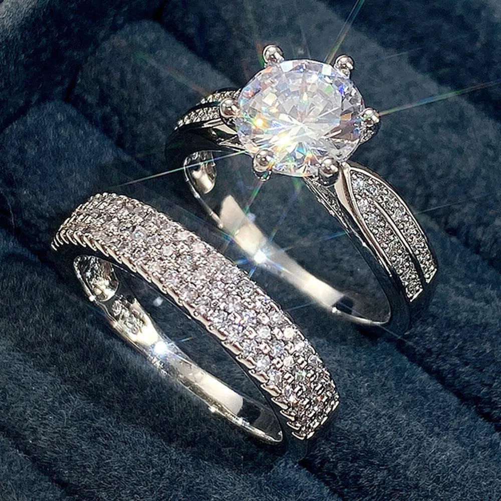 Geometric style wedding ring paired with a matching simple bracelet band in a white gold colour finish.