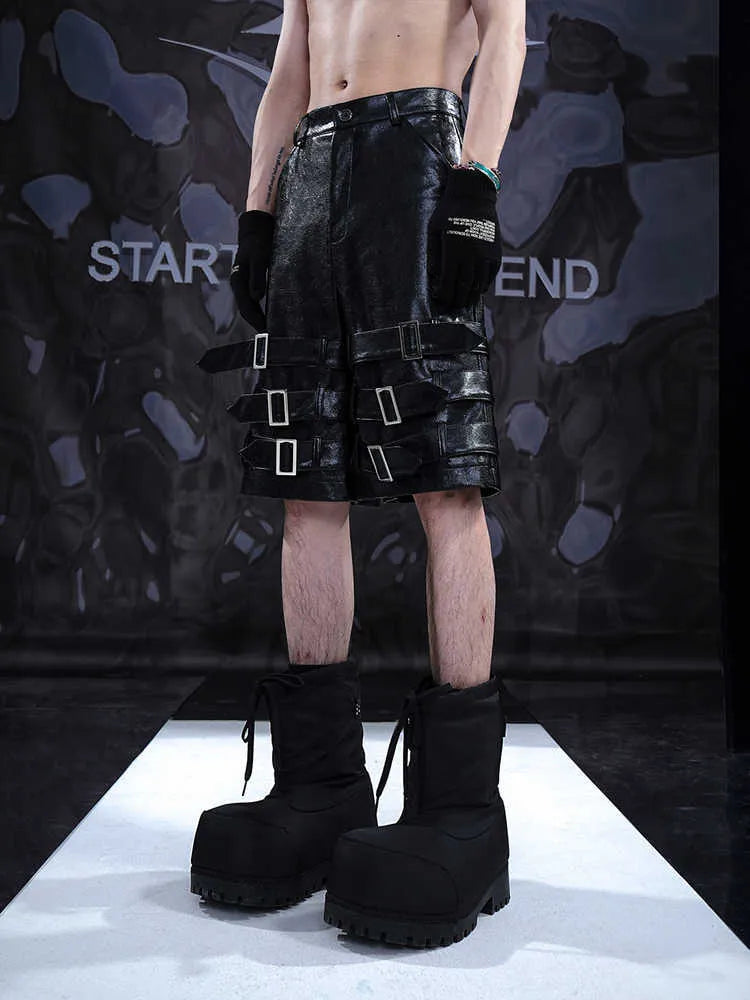 Black men's PU leather casual cropped shorts with a medium low waist on a mannequin.