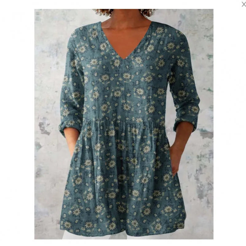 Women's printed loose dress with wide waist and three-quarter sleeves in a wave pattern.
